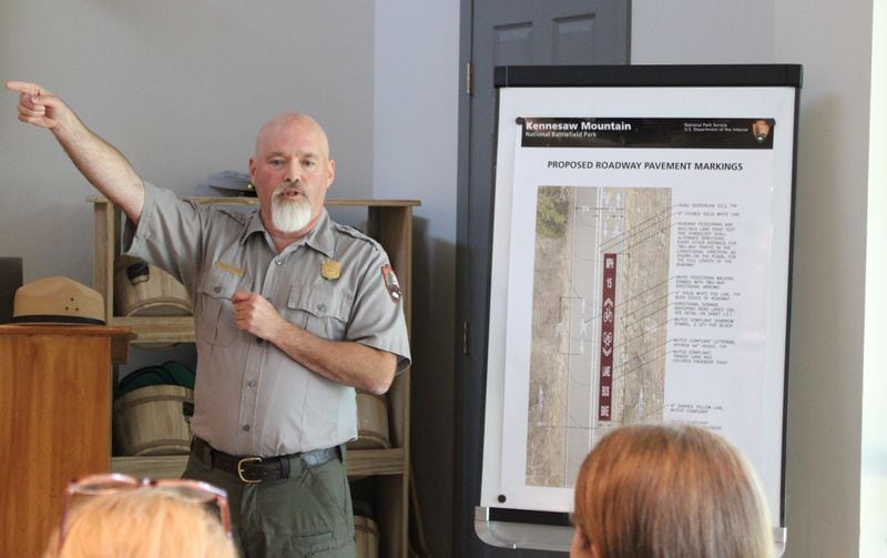 Kennesaw Mountain National Battlefield Park's Superintendent Patrick Gammon presents proposed changes to Kennesaw Mountain road access on Monday, July 1, 2024. The plan would eliminate cars, implement a shuttle during weekedays, and limit bikes to certain times of day. (Taylor Croft/taylor.croft@ajc.com)