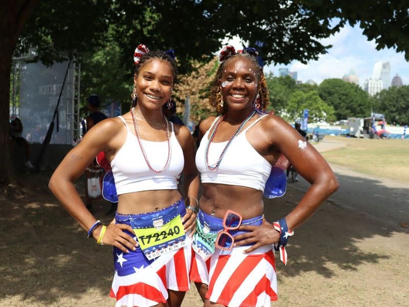 Kimberly Alexander, with her daughter Emily, after finishing the AJC Peachtree Road Race on July 4, 2024. Libby Hobbs/AJC