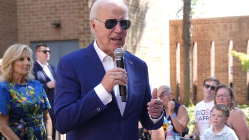 President Joe Biden speaks to supporters as first lady Jill Biden, left, looks on at a campaign rally in Harrisburg, Pa., on Sunday, July 7, 2024. (AP Photo/Manuel Balce Ceneta)