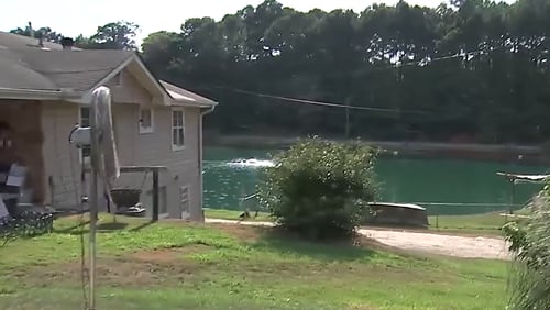A father allegedly killed his son at a popular fishing spot run by the family in Newton County on Friday night, police said.