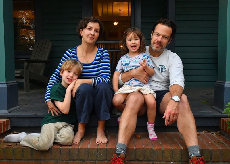 Sarah O'Brien, husband Paul Calvert, their eight-year-old son Wally and four-year-old daughter Stevie sit on the front porch of their home in Atlanta's Grant Park neighborhood. (CHRIS HUNT FOR THE ATLANTA JOURNAL-CONSTITUTION)