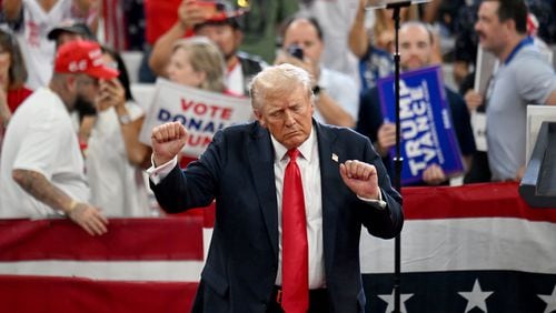 Former President Donald Trump dances as he leaves the stage during a rally at the Georgia State University’s convocation center on Saturday, August 3, 2024 in Atlanta. (Hyosub Shin / AJC)