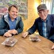 McCracken Poston (left) and Alvin Ridley earlier this year in a Ringgold coffee shop that once housed Ridley's TV repair business. Poston and Ridley formed a friendship 25 years ago when Poston  successfully defended Ridley on a murder charge.