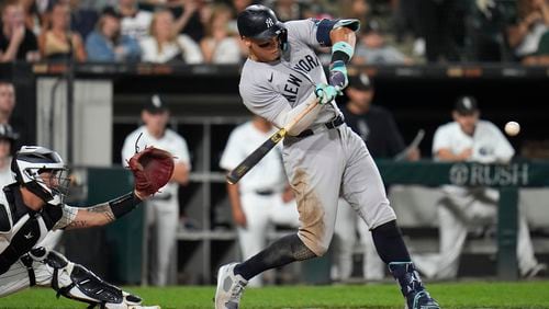 New York Yankees designated hitter Aaron Judge hits his 300th career home run, the fastest playing in MLB history to do so, during the eighth inning of a baseball game against the Chicago White Sox, Wednesday, Aug. 14, 2024, in Chicago. (AP Photo/Erin Hooley)