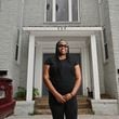 Robyn Mincey, resident, poses for a portrait outside the apartment complex owned by Atlanta-based real estate investment firm Roots, July 3, 2024, in Atlanta. Atlanta-based real estate investment firm Roots allows tenants in properties to invest their security deposit to help grow their savings and build credit. (Hyosub Shin / AJC)