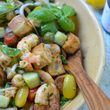 Panzanella, a traditional Italian bread salad, is transformed into a filling salad supper with the addition of garlicky shrimp. (Virginia Willis for The Atlanta Journal-Constitution)