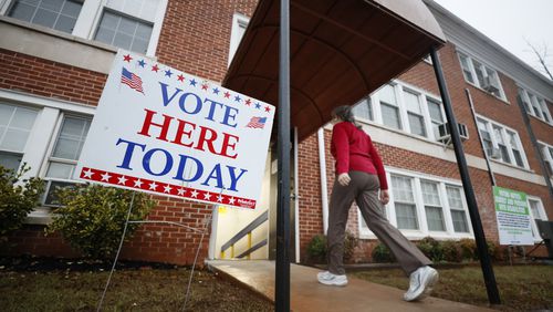 A person enters the Israel Baptist Church in Kirkwood during election day on Tuesday, December 6, 2022. (Miguel Martinez/miguel.martinezjimenez@ajc.com)