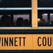 Students wait in the bus as they arrive for the first day of school at Seckinger High School in Buford on Wednesday, August 3, 2022. Gwinnett expects a revenue hit due to a newly expanded homestead exemption. (Hyosub Shin / Hyosub.Shin@ajc.com)