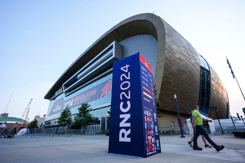 People walk outside the Fiserv Forum ahead of the 2024 Republican National Convention, Saturday, July 13, 2024, in Milwaukee. Donald Trump's campaign said in a statement that the former president was "fine" after a shooting at his rally in Butler, Pa. A local prosecutor says the suspected gunman and at least one attendee are dead. (AP Photo/Alex Brandon)