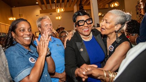 Former Commissioner Lorraine Cochran-Johnson  (second from right) will be the next chief executive officer of DeKalb County.