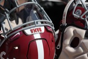 Alabama football helmet hangs on a rack before practice at Thomas-Drew Practice Fields in Tuscaloosa, AL on Tuesday, Sep 13, 2022.
