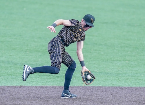 Oxford’s Carter Johnson fields a grounder at shortstop against Vestavia Hills