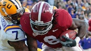 Alabama  wide receiver Julio Jones (8) catches a touchdown pass in front of LSU cornerback Patrick Peterson (7) in the second half of an NCAA college football game in Baton Rouge,  Saturday, Nov. 6, 2010. LSU defeated Alabama 24-21.  (AP Photo/Bill Haber)