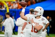 Texas quarterback Arch Manning (16) warms up before the Sugar Bowl CFP NCAA semifinal college football game against Washington, Monday, Jan. 1, 2024, in New Orleans. (AP Photo/Jacob Kupferman)