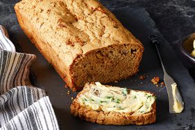 mom's zucchini bread with a slice cut and buttered.