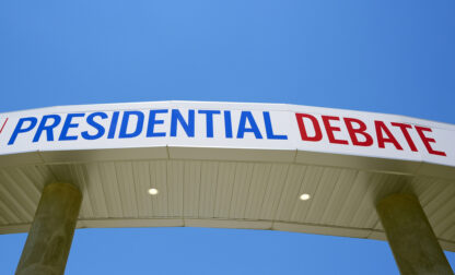 Signage for the upcoming presidential debate is seen at the media file center near the CNN Techwood campus in Atlanta on Tuesday, June 25, 2024. A new poll finds that most U.S. adults plan to watch or listen to some element of Thursday's presidential debate. (AP Photo/Pablo Martinez Monsivais)