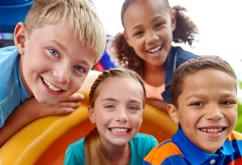 four kids smiling