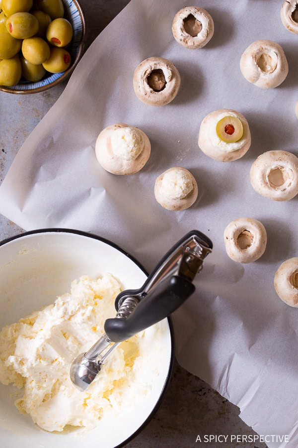 How to Make Spooky 5-ingredient Stuffed Mushroom Eyeballs for Halloween on ASpicyPerspective.com 