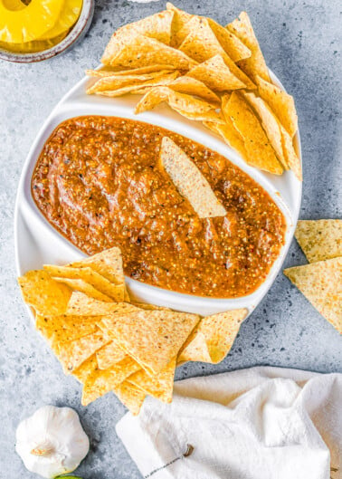 Pineapple Chipotle Salsa - A sweet and spicy salsa with a lovely smokiness from pineapple, tomatillo, onion, and garlic that are blistered under broiler and then blended with chipotle peppers! PERFECT over tacos, with chips, or as a great addition to any Mexican-inspired meal! 