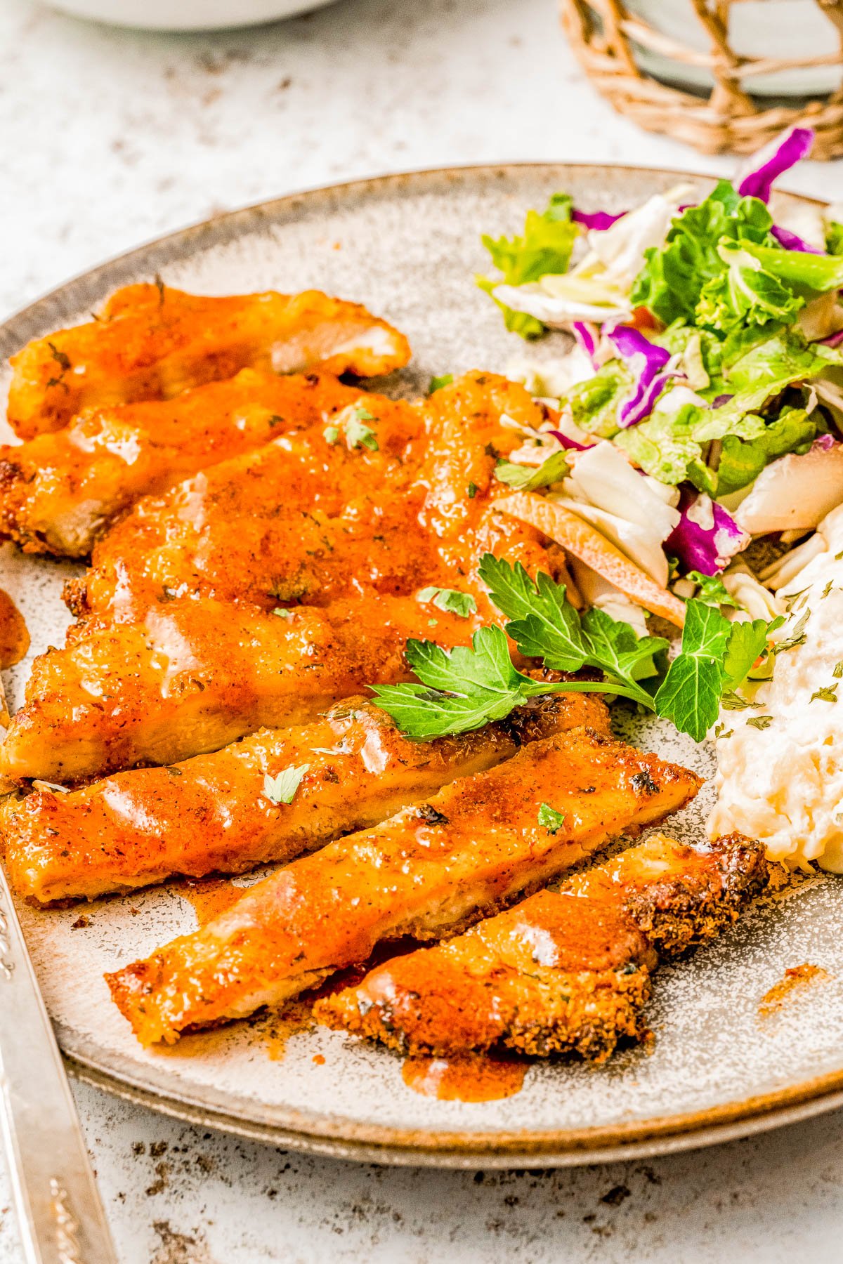 Air Fryer Hot Honey Chicken — Breaded chicken cutlets are air fried until crispy, then drizzled with spicy-sweet hot honey! This is such a QUICK and EASY air fryer chicken recipe that takes less than 30 minutes to prepare! Oven-baking instructions are also provided.