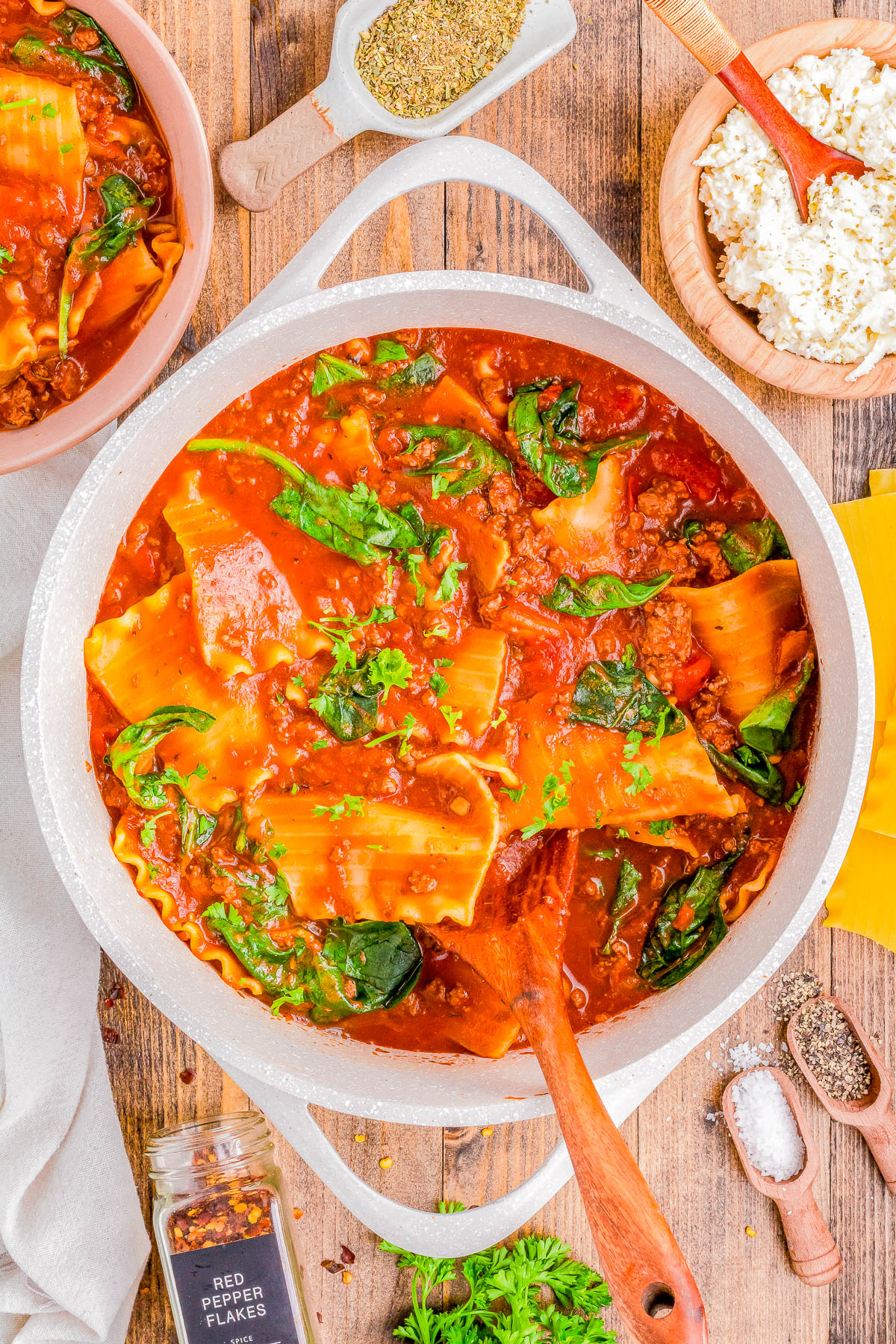 Lasagna Soup with Ground Beef - Ready in 30 minutes and made in one pot, this EASY lasagna soup is the perfect, hearty, comfort food recipe! Big chunks of ground beef, tender noodles, a tomato-based broth, and topped with a three-cheese mixture of ricotta, mozzarella, and Parmesan! If you like lasagna, you're going to LOVE this soup version of the Italian classic!