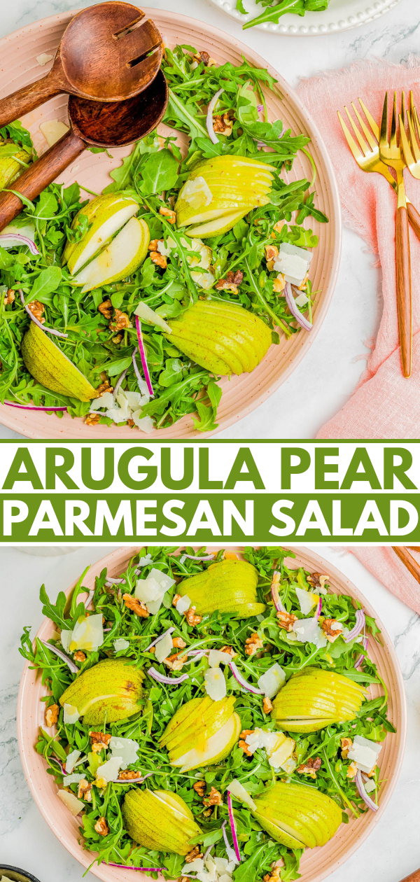 A fresh arugula salad with sliced pears, parmesan, red onions, and walnuts, garnished with a wooden spoon and fork, and gold utensils placed on a pink napkin beside the plate. Text reads "ARUGULA PEAR PARMESAN SALAD.