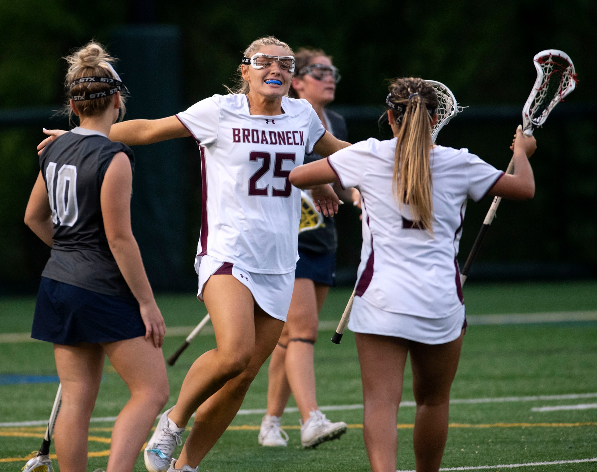 Broadneck's Olivia Orso, center, reacts with Ceci Facciponti, right, after scoring against Urbana in the Class 4A girls state lacrosse championship at Stevenson University in Owings Mills. Broadneck won 10-9.(John Gillis/Freelance)