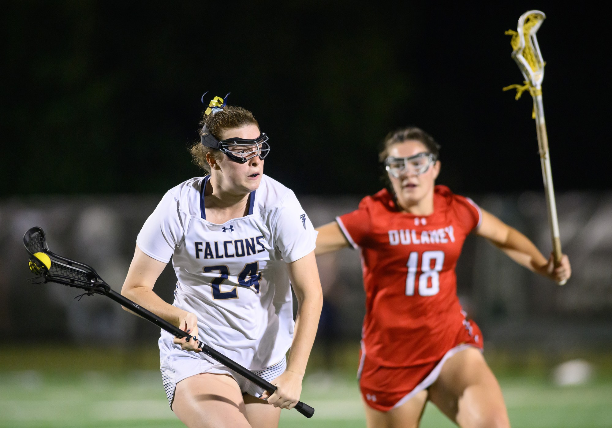 Severna Park's Ryn Feemster, left, runs past Dulaney's Heidi Schmidt during the Class 3A girls lacrosse state championship. (Steve Ruark/for Capital Gazette)