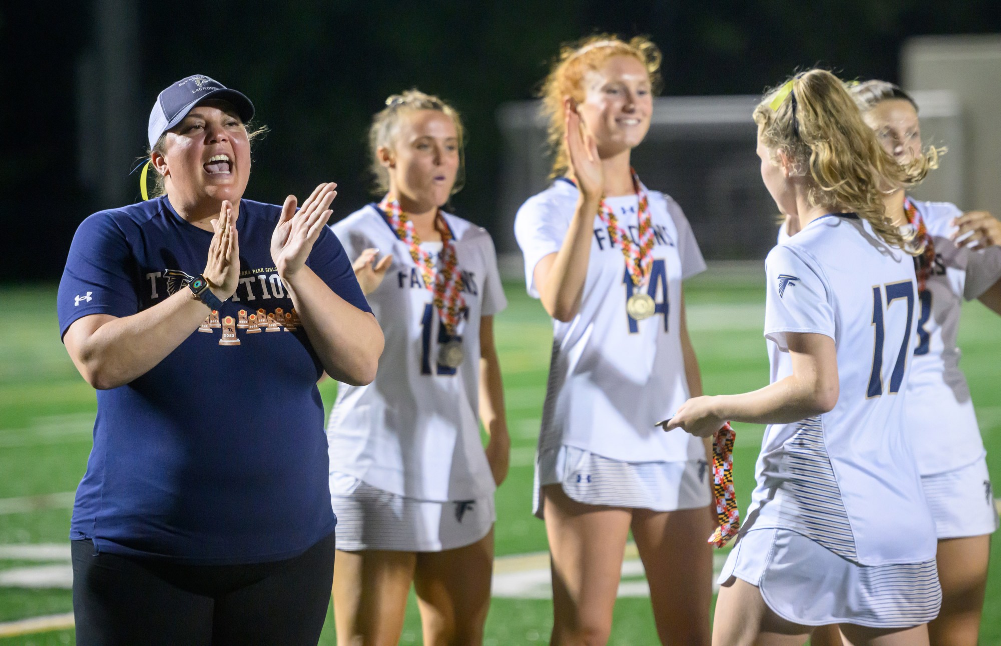 Severna Park head coach Annie Houghton claps after her team's 12-6 win against Dulaney in the Class 3A girls lacrosse state championship. (Steve Ruark/for Capital Gazette)