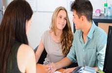 Young couple talking together in an office