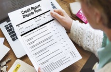 Woman reviewing credit report dispute form