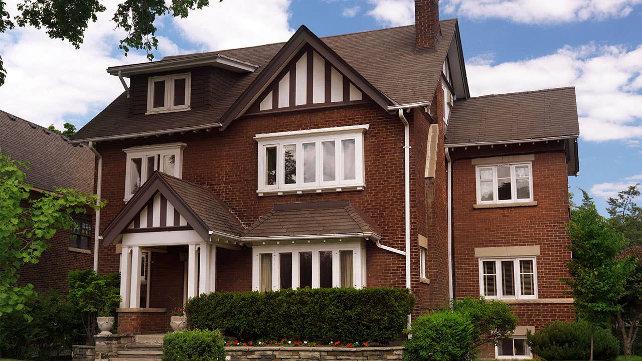 Brick house with bushes in front