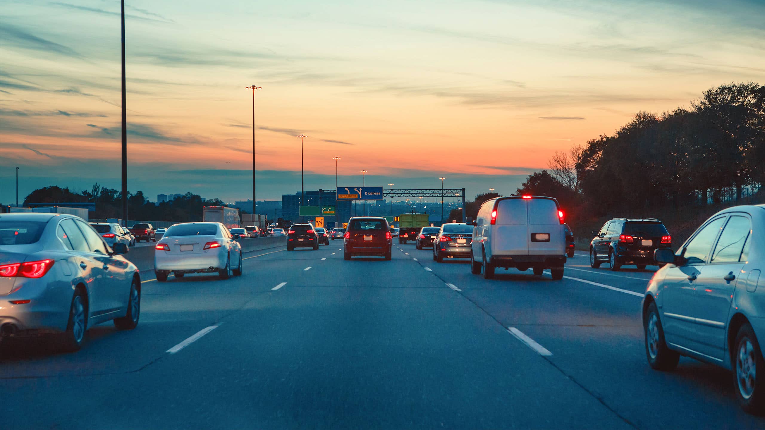 Cars in traffic at dusk