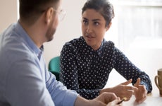 couple sitting at table having a conversation