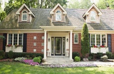 Brick home with landscaped front yard