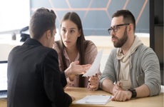 Couple discussing finances with lawyer