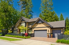 Yellow house with trees