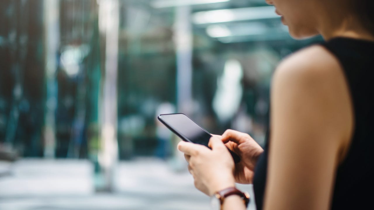 Woman looking at cell phone