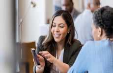 A bank representative helps a customer with buying a home.