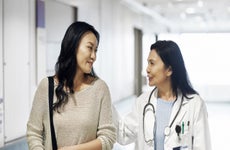 A woman consulting her health specialist.