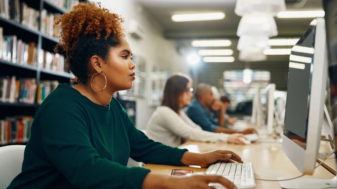 A woman participates in an online class