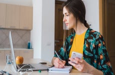 Woman paying bills online