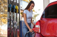 Woman pumping gas