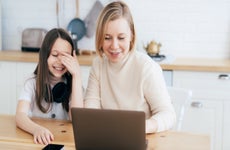 A woman and daughter work together