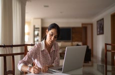 Woman paying bills online