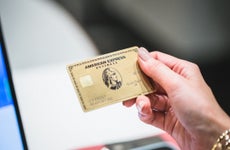 Person holding the Amex Business Gold Card