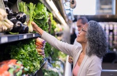 Woman at grocery store in produce section