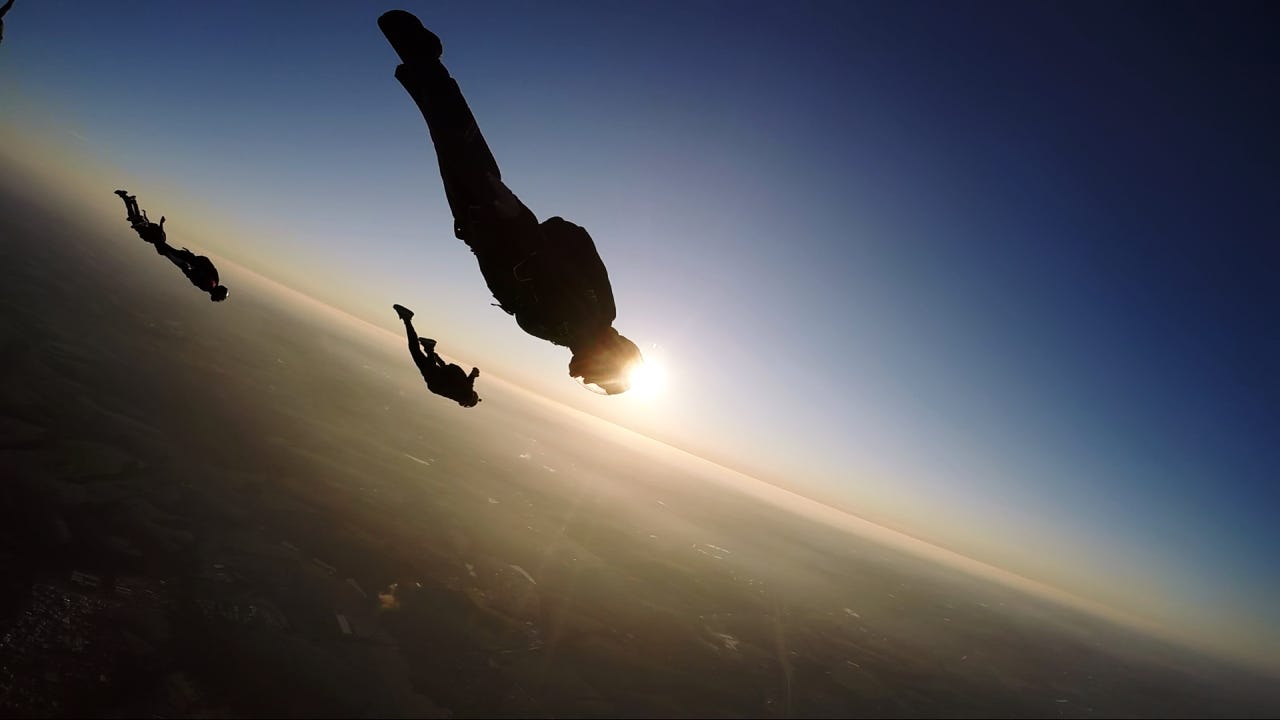 Skydiving group at the sunset