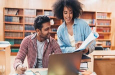 College students collaborating in the library