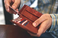 man pulling card out of wallet